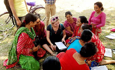 Student talks with local women in Nepal