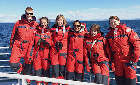 Six students aboard a whale watching boat in Iceland
