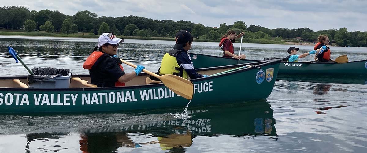 Nature for New Minnesotans in canoes on Lake Itasca.